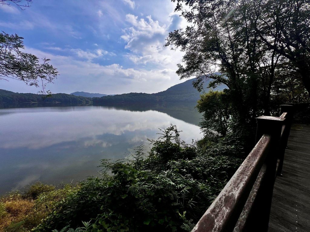 Mountain and forest views reflected in Okkye Reservoir in Yesan