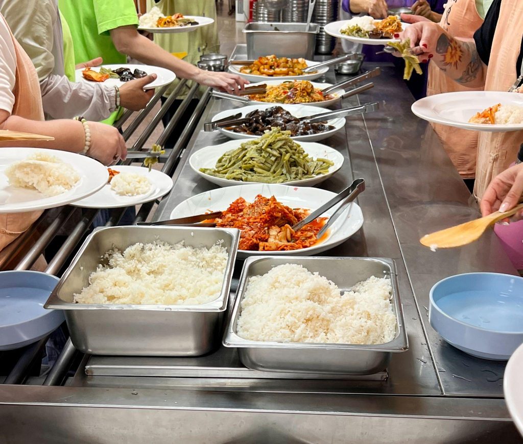 Participants serving Korean Buddhist temple food during a Sudeoksa Templestay
