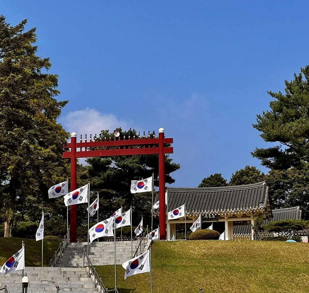 Chunguisa Shrine with Korean flags at the Yun Bong-gil historic site in Yesan